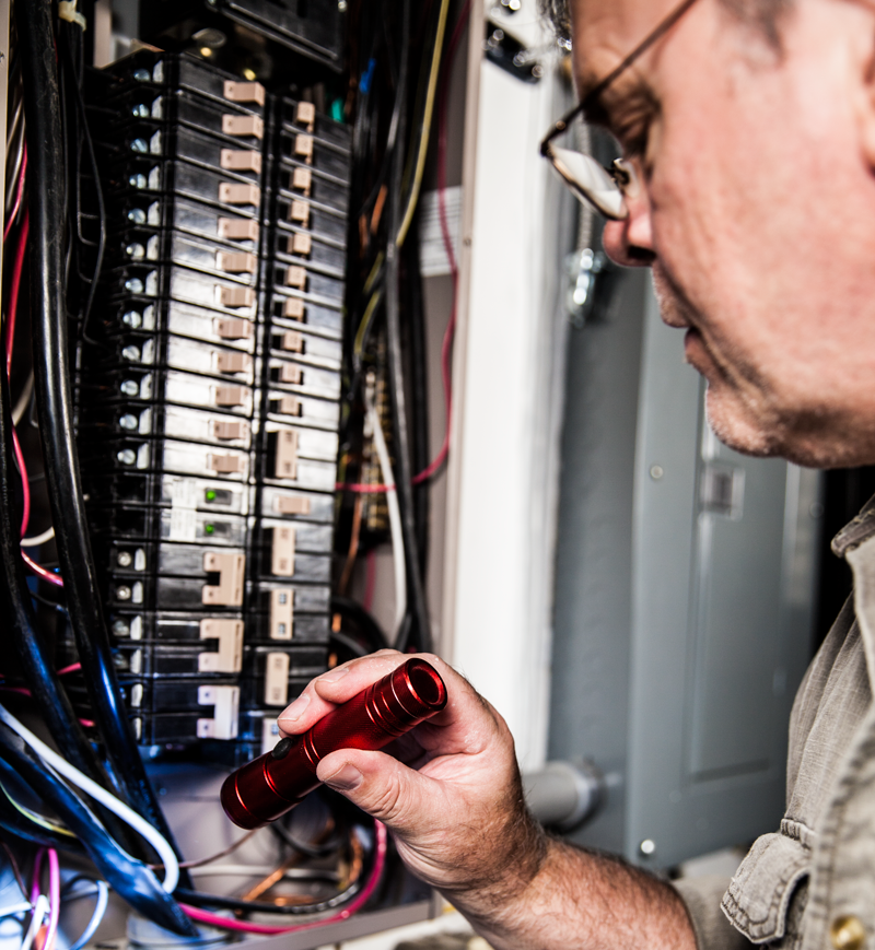 new bern home inspector examining an electrical panel